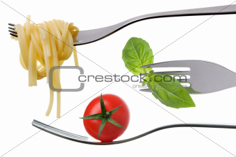 spaghetti basil and tomato on forks isolated
