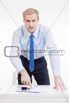 angry boss standing behind desk, gesticulating, accusing, blaming