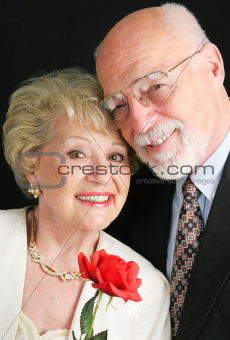 Elegant Senior Couple with Rose