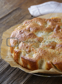 homemade apple pie on a wooden table