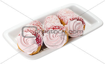 Cake with pink cream on a plate