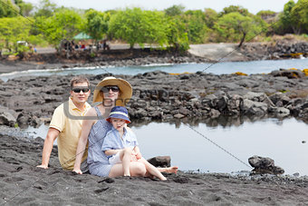 family at the black sand beach