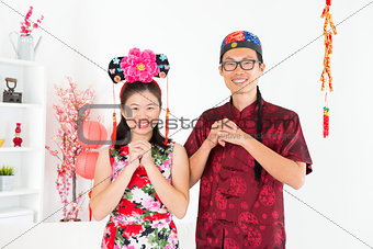 Asian people blessing during Chinese New Day