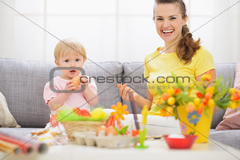 Baby and mother having fun on Easter