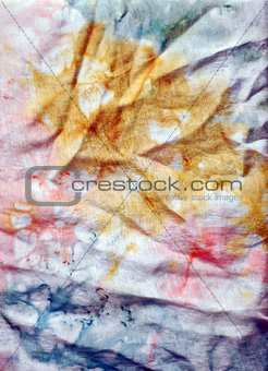A close-up of a silk fabric colored by batik