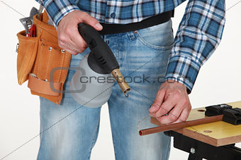 Tradesman using a blowtorch