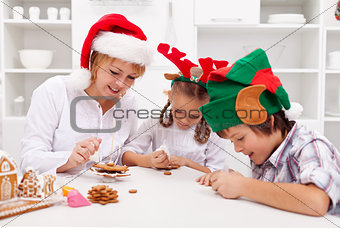 Happy christmas family decorating gingerbread cookies