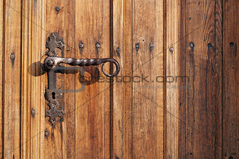 Ancient door handle on old door