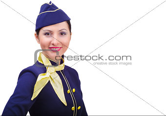 Beautiful young  smiling stewardess in uniform isolated on a white background