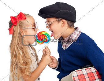 Kids sharing a large lollipop