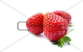 three fresh strawberries on white