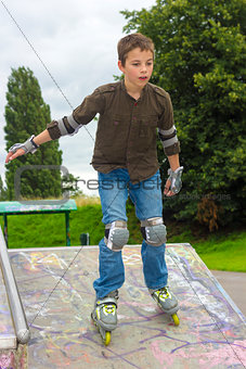 Shot of concentrated sliding rollerskaters in protection kit