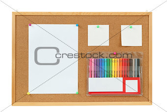 color markers with notes on cork board 