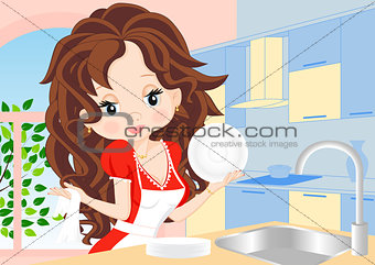 woman wipes the dishes in the kitchen