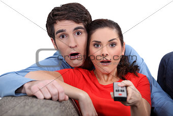 Couple staring at the screen in disbelief