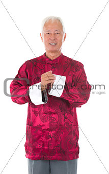 asian  senior chinese man celebrating lunar new year