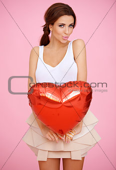 Seductive woman with a red heart