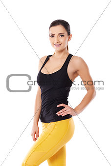 Beautiful sexy woman in yellow gym tights