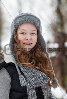 Teenager girl in a snowy park