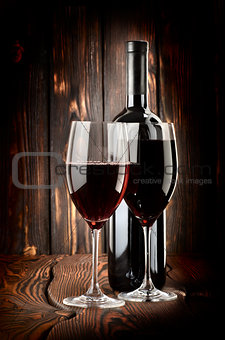 Two glasses of wine and wine bottle