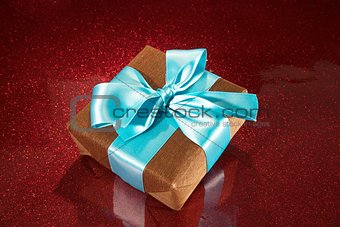 gift on red sparkling background