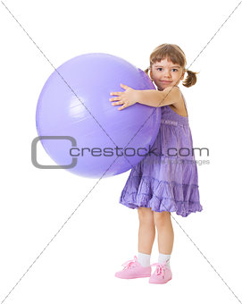 Little girl with a big purple ball