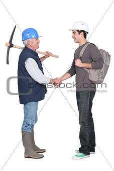Apprentice shaking hands