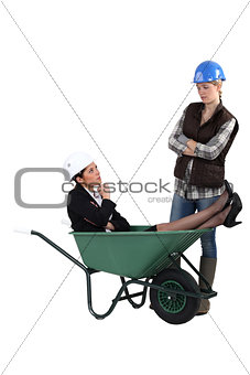 Unhappy tradeswoman distraught at finding an engineer in her wheelbarrow