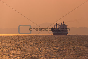 freighter under sunset