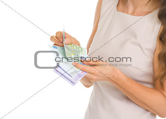 Closeup on woman counting euros