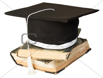 Mortar board on a stack of books