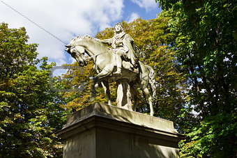 The statue of Louis XIII riding a horse in Place des Vosges, Par