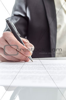 Businessman signing closeup