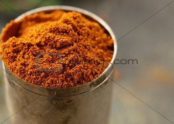 paprika spice in metal bowl macro shot soft focus