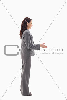Profile of businesswoman shaking hands