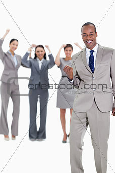 Successful business team with a happy businessman in foreground