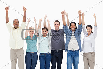 People raising their arms with the thumbs-up
