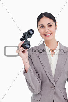 Smiling businesswoman with spy glasses