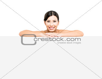 Asian woman showing a blank billboard