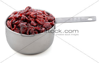 Dried cranberries presented in an American metal cup measure