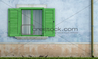 Old house with green wooden windows