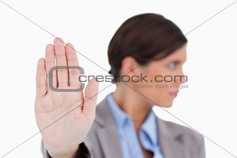 Close up of female entrepreneurs hand signalizing stop