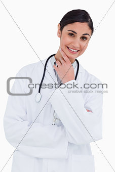 Smiling female doctor in thinkers pose