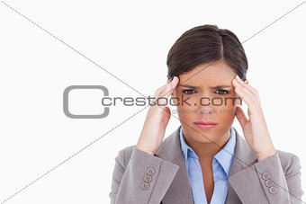 Close up of female entrepreneur having a headache