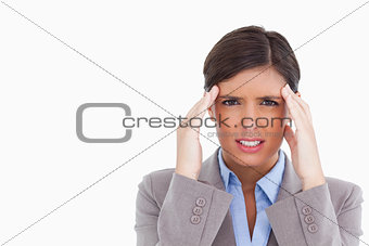 Close up of female entrepreneur experiencing a headache