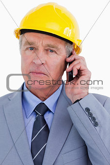 Close up of mature architect on his cellphone