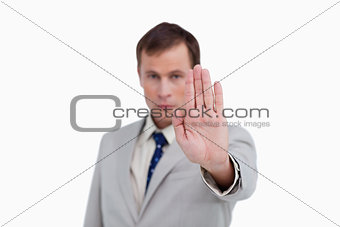 Close up of businessman's palm signalizing stop