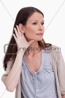 Close up of young woman listening closely