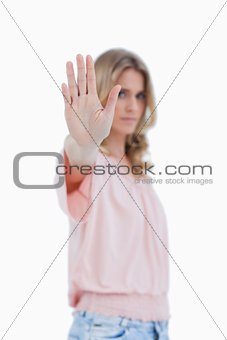 Focus shot of a woman with her hand held out to the camera