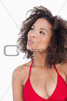 Attractive brunette woman puckering her lips